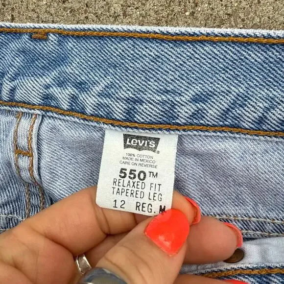 Vintage 90s Levi's 550 Relaxed Fit Tapered Leg Light Blue Jeans Size 12 Reg M